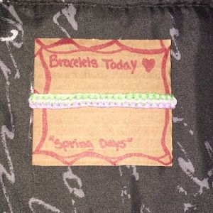 A zipper styled bracelet made of cotton string.